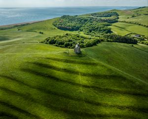 Preview wallpaper plain, hills, grass, castle, trees, landscape