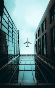 Preview wallpaper plane, bottom view, building, sky