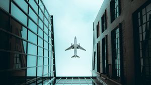 Preview wallpaper plane, bottom view, building, sky