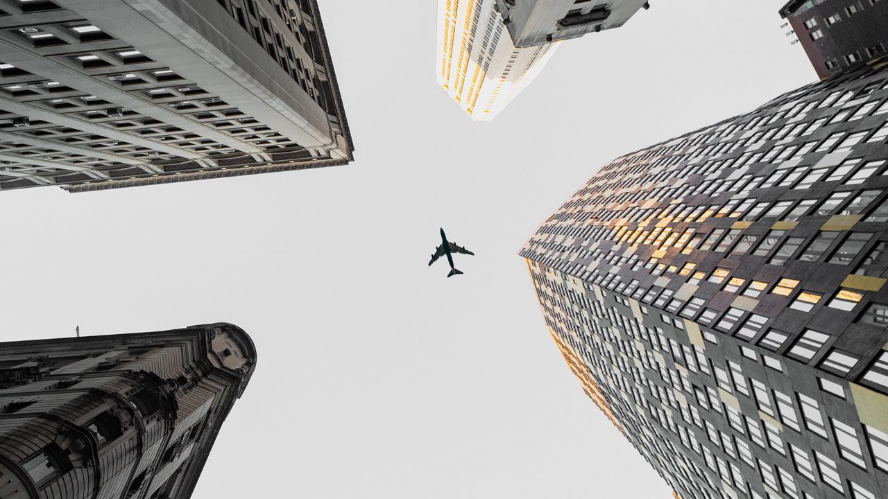 Wallpaper plane, buildings, city, bottom view