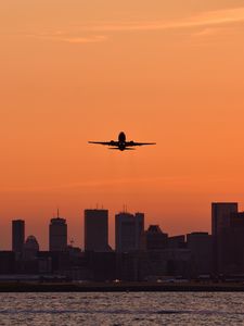 Preview wallpaper plane, flight, buildings, city, twilight