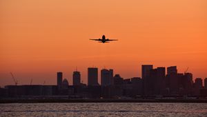 Preview wallpaper plane, flight, buildings, city, twilight