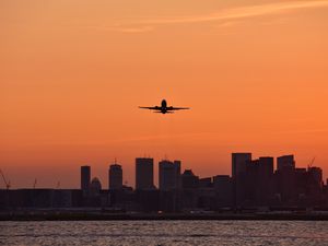 Preview wallpaper plane, flight, buildings, city, twilight
