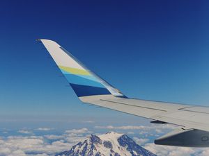Preview wallpaper plane, mountains, clouds, sky