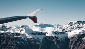 Preview wallpaper plane, mountains, rocks, clouds