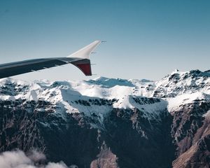 Preview wallpaper plane, mountains, rocks, clouds