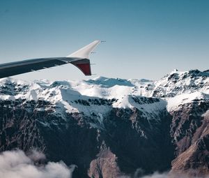 Preview wallpaper plane, mountains, rocks, clouds