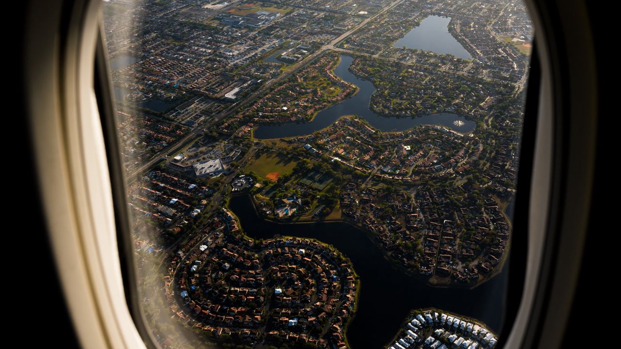 Wallpaper plane, porthole, city, aerial view