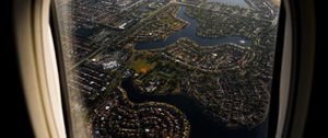 Preview wallpaper plane, porthole, city, aerial view