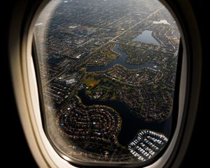 Preview wallpaper plane, porthole, city, aerial view