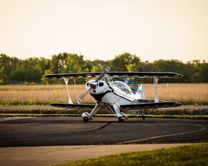 Preview wallpaper plane, propeller, asphalt, field
