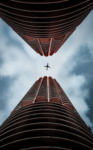 Preview wallpaper plane, skyscrapers, bottom view, sky, architecture