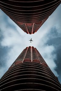 Preview wallpaper plane, skyscrapers, bottom view, sky, architecture