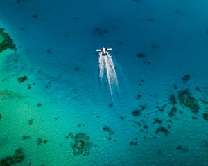 Preview wallpaper plane, trail, sea, water, aerial view