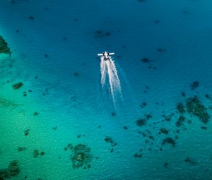 Preview wallpaper plane, trail, sea, water, aerial view