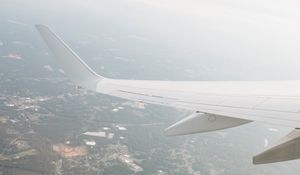 Preview wallpaper plane, wing, city, view, height