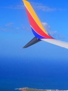 Preview wallpaper plane, wing, island, sea, sky, height