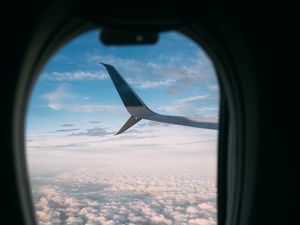 Preview wallpaper plane, wing, porthole, view, clouds