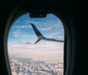 Preview wallpaper plane, wing, porthole, view, clouds