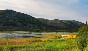 Preview wallpaper plane, yellow, field, hills, landscape