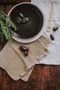 Preview wallpaper plate, stones, plant, cloth, wooden