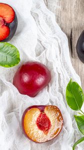 Preview wallpaper plum, fruit, leaves, cloth, wooden