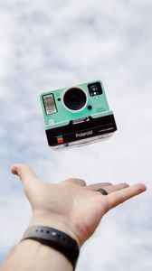 Preview wallpaper polaroid, camera, hand, sky