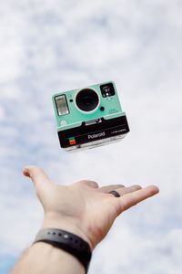 Preview wallpaper polaroid, camera, hand, sky