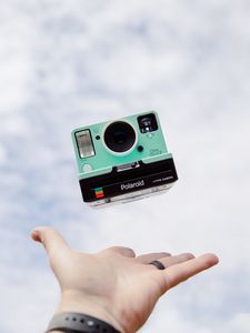 Preview wallpaper polaroid, camera, hand, sky