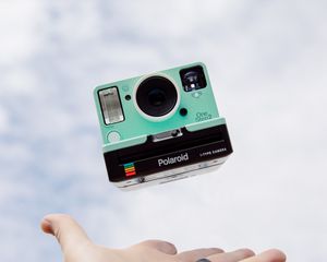 Preview wallpaper polaroid, camera, hand, sky