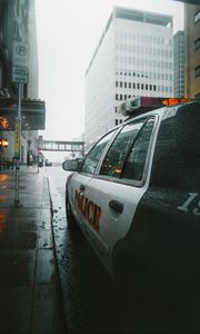 Preview wallpaper police, car, street, city, rain
