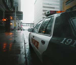 Preview wallpaper police, car, street, city, rain