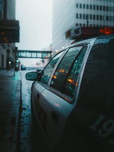 Preview wallpaper police, car, street, city, rain, fog