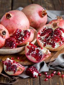 Preview wallpaper pomegranate, fruit, berries, dishes, still life