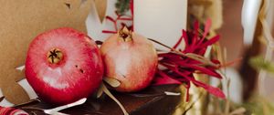 Preview wallpaper pomegranate, fruit, candles, garland, christmas, aesthetics