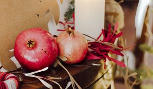 Preview wallpaper pomegranate, fruit, candles, garland, christmas, aesthetics