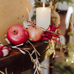 Preview wallpaper pomegranate, fruit, candles, garland, christmas, aesthetics
