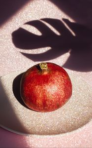 Preview wallpaper pomegranate, fruit, plate, shadow