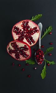 Preview wallpaper pomegranate, fruit, red, spoon, leaves
