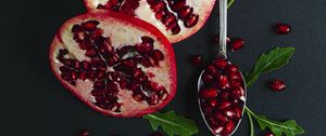 Preview wallpaper pomegranate, fruit, red, spoon, leaves