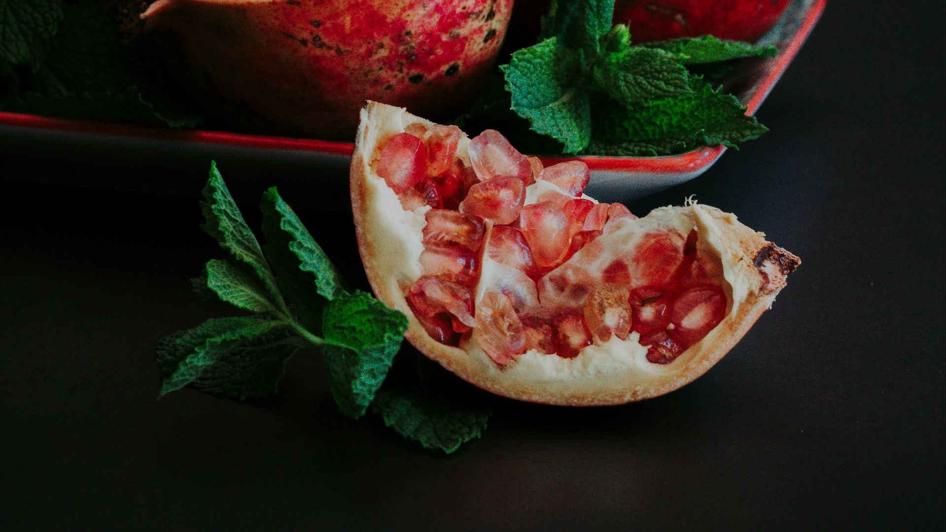 Download wallpaper 1920x1080 pomegranate, slice, fruit, still life