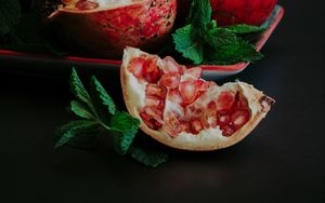 Preview wallpaper pomegranate, slice, fruit, still life, leaves