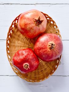 Preview wallpaper pomegranates, fruit, basket