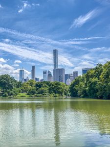 Preview wallpaper pond, buildings, trees, sky, nature, city