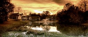 Preview wallpaper pond, fountain, houses, cloudy, evening