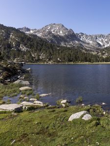 Preview wallpaper pond, mountains, grass, stones, landscape, nature