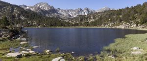 Preview wallpaper pond, mountains, grass, stones, landscape, nature