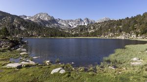 Preview wallpaper pond, mountains, grass, stones, landscape, nature