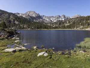 Preview wallpaper pond, mountains, grass, stones, landscape, nature