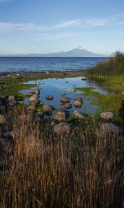 Preview wallpaper pond, stones, sea, volcano, nature